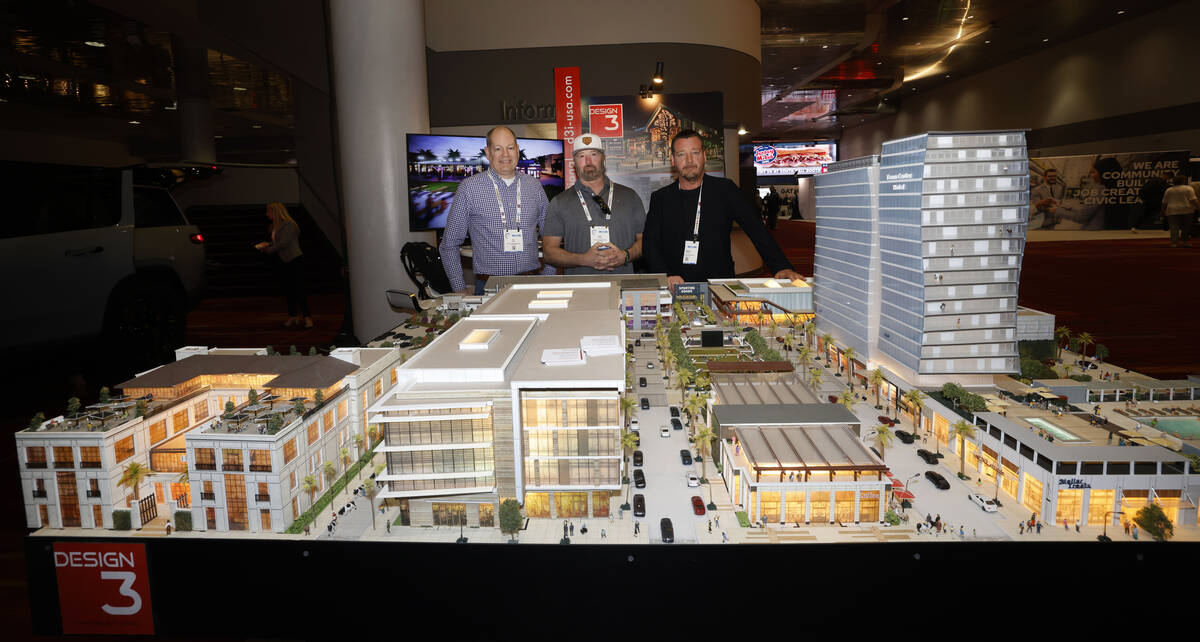 Design 3 International’s Lake Nona Town Center model is seen as MJ Dame, marketing direc ...