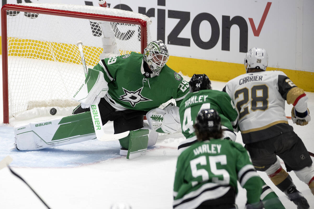 Golden Knights left wing William Carrier (28) scores a goal on Dallas Stars goaltender Jake Oet ...