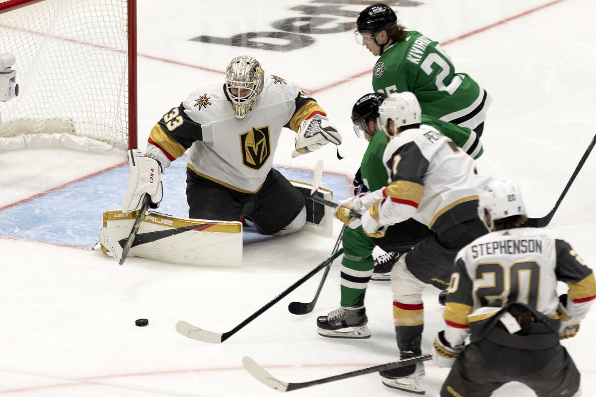 Golden Knights goaltender Adin Hill (33) prepares to save a shot by Dallas Stars center Radek F ...