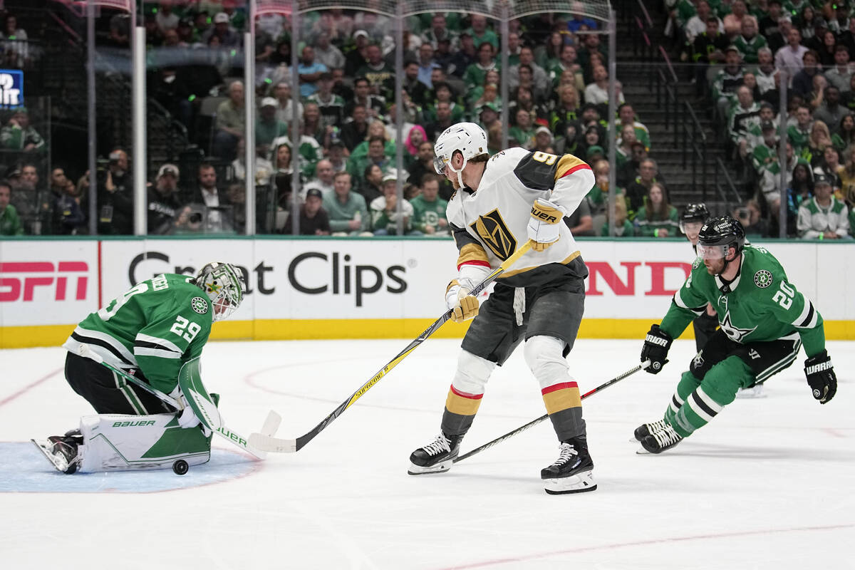 Dallas Stars goaltender Jake Oettinger (29) deflects a shot from Vegas Golden Knights center Ja ...