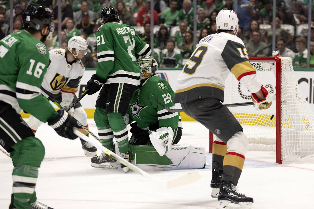 Golden Knights center William Karlsson, second from left, scores on Dallas Stars goaltender Jak ...