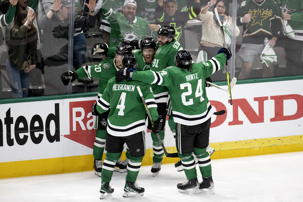 The Dallas Stars rally around center Joe Pavelski (16) after he scored the game-winning goal du ...