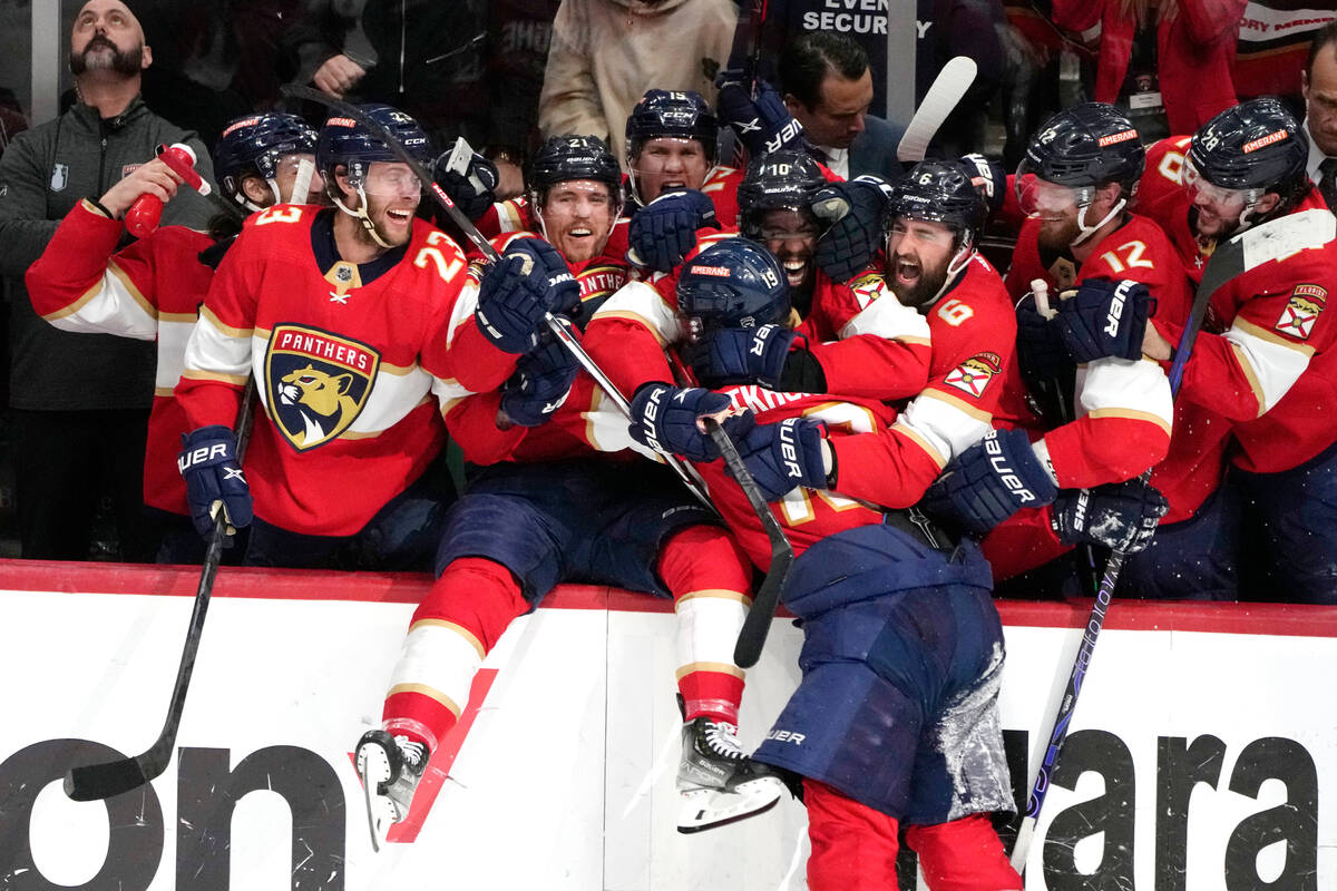 Florida Panthers left wing Matthew Tkachuk, center, celebrates with his teammates after scoring ...