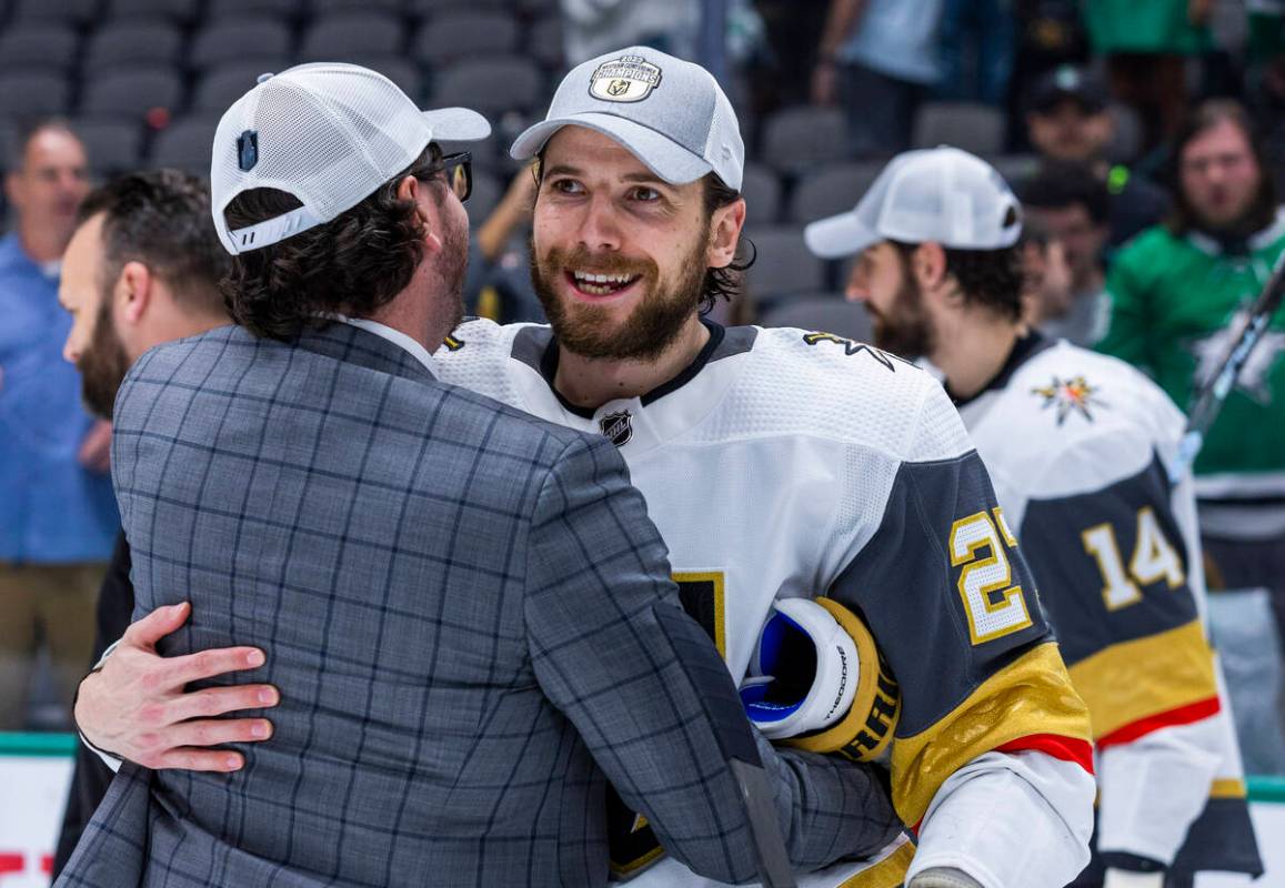 Golden Knights defenseman Shea Theodore (27) is congratulated on the ice after defeating the Da ...