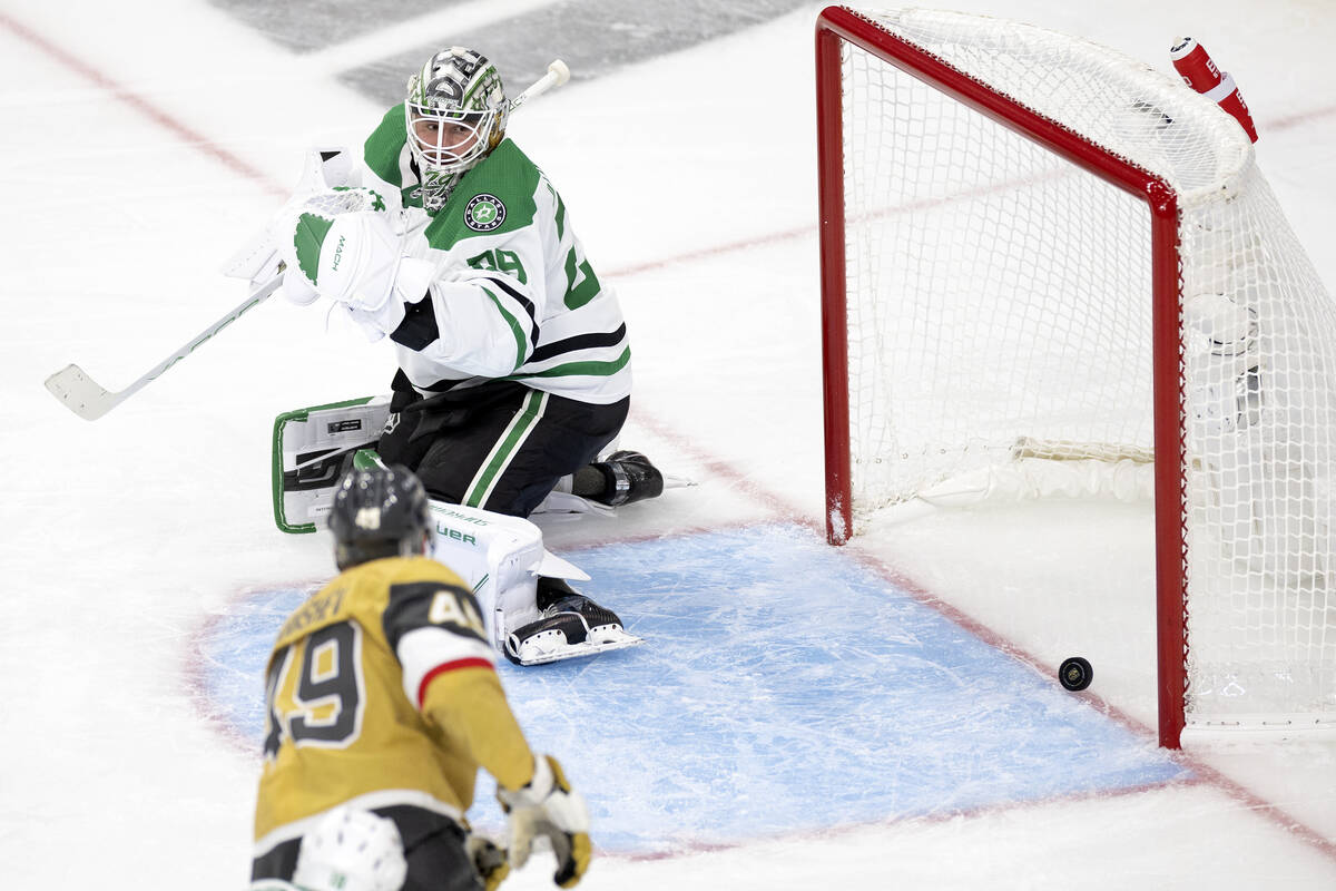 Dallas Stars goaltender Jake Oettinger (29) can’t save a shot by Golden Knights center C ...