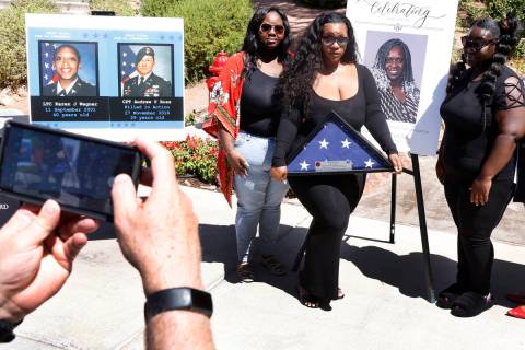Arrianna Savage, left, her sisters Micah King, and Nia, right, pose for a photo in front of the ...