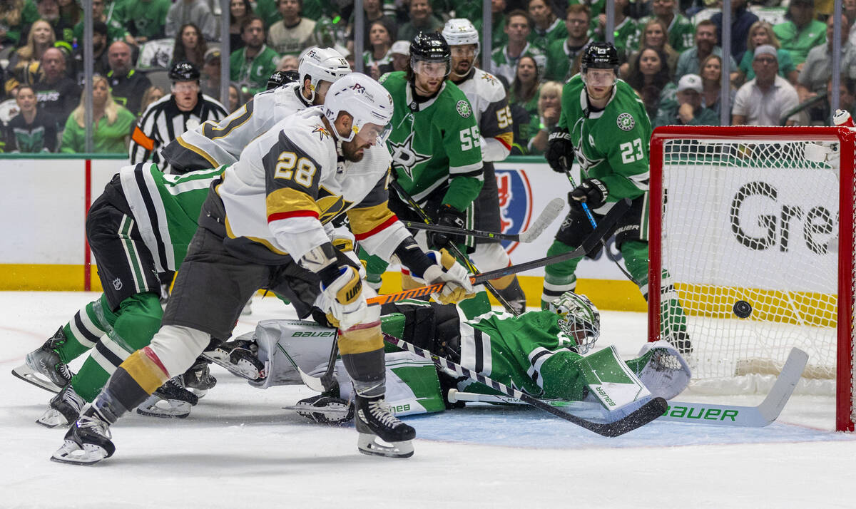 Golden Knights left wing William Carrier (28) shoots past Dallas Stars goaltender Jake Oettinge ...