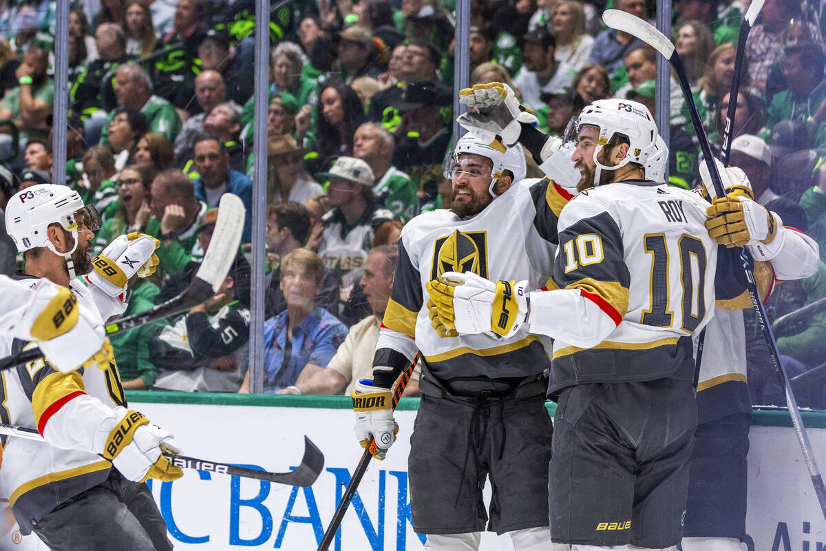 Golden Knights players celebrate a goal against the Dallas Stars in the first period during Gam ...