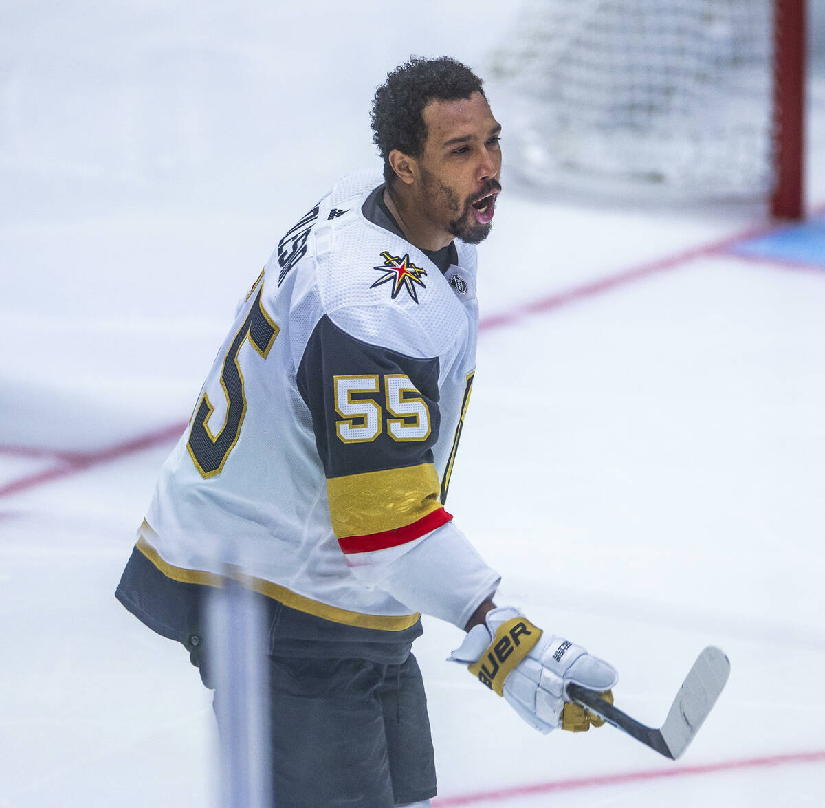 Golden Knights right wing Keegan Kolesar (55) reacts to his helmet being ripped off by the Dall ...