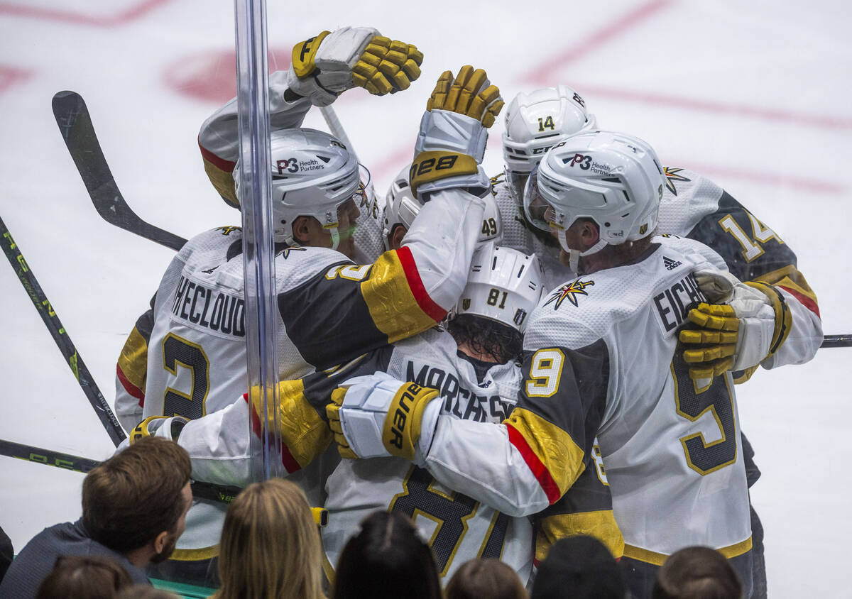 Golden Knights players celebrate the fourth goal against the Dallas Stars in the second period ...