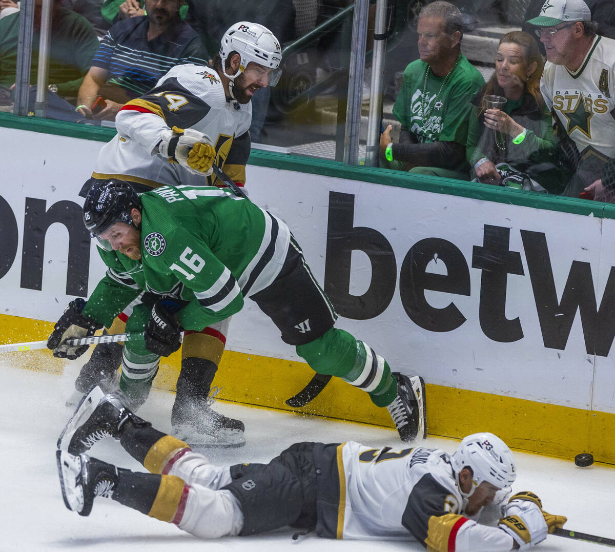 Dallas Stars center Joe Pavelski (16) sends Golden Knights defenseman Zach Whitecloud (2) to th ...