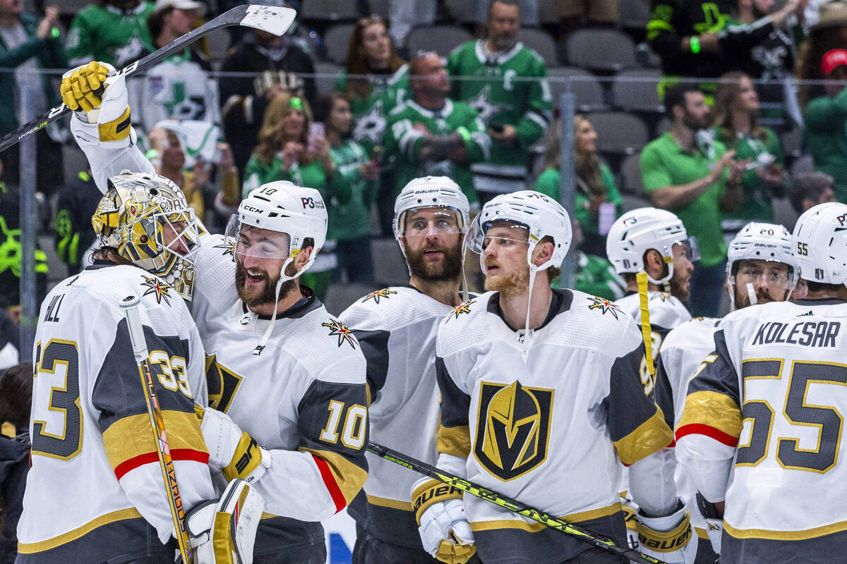 Golden Knights players celebrate on the ice after defeating the Dallas Stars 6-0 during Game 6 ...