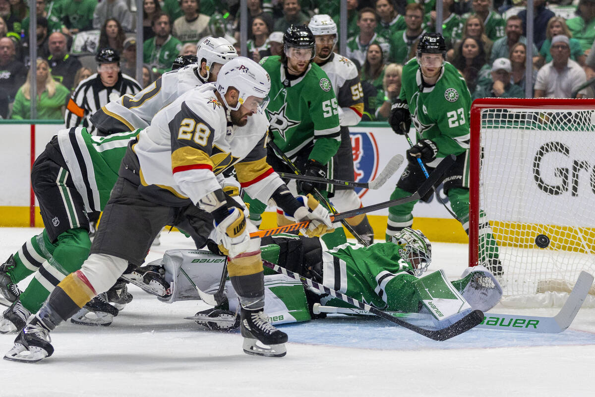 Golden Knights left wing William Carrier (28) shoots past Dallas Stars goaltender Jake Oettinge ...