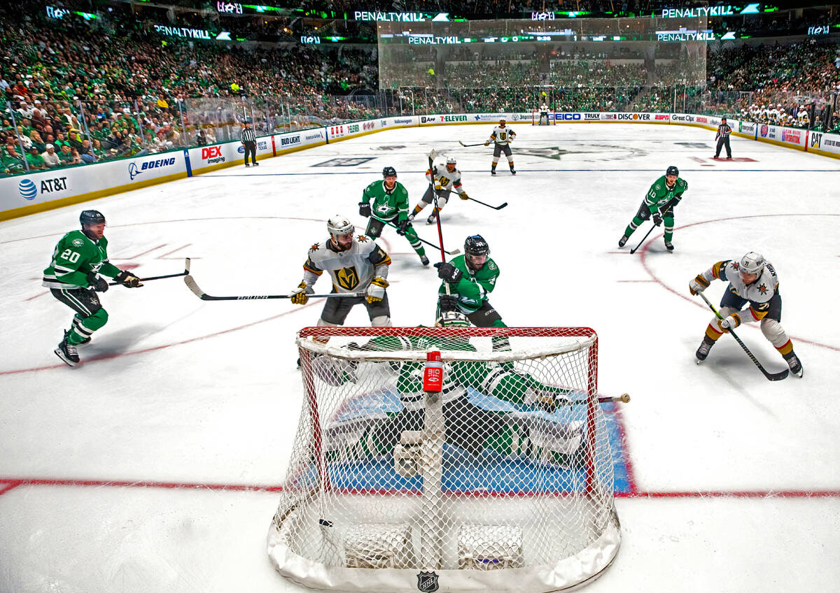 Golden Knights center William Karlsson (71) scores on Dallas Stars goaltender Jake Oettinger (2 ...