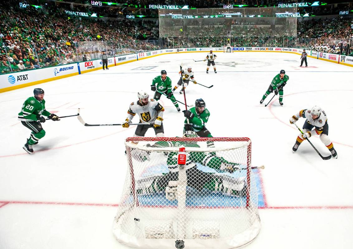 Golden Knights center William Karlsson (71) scores on Dallas Stars goaltender Jake Oettinger (2 ...