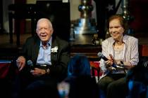 FILE - Former President Jimmy Carter and his wife former first lady Rosalynn Carter sit togethe ...