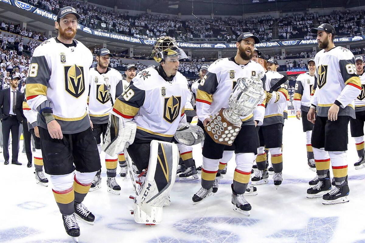 Vegas Golden Knights' James Neal (18), Deryk Engelland (5), goaltender Marc-Andre Fleury (29) a ...