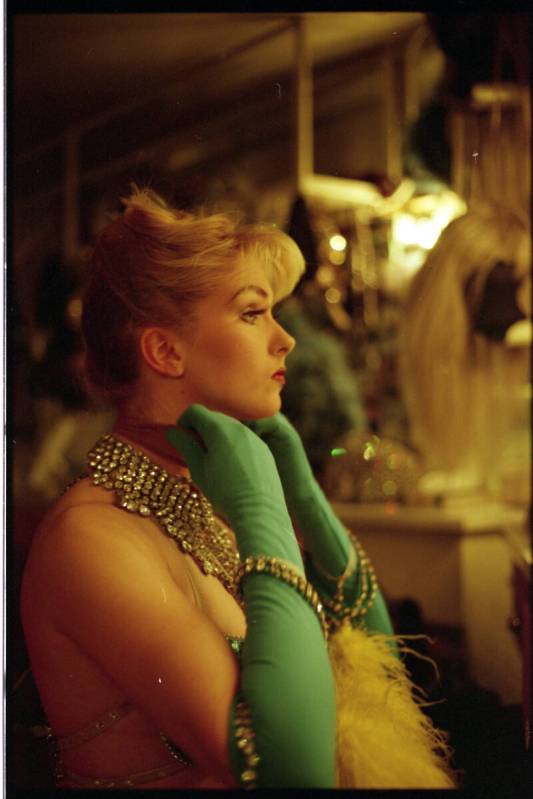 A show showgirls from "Folies Bergere" gets ready for a show in her dressing room at the Tropic ...