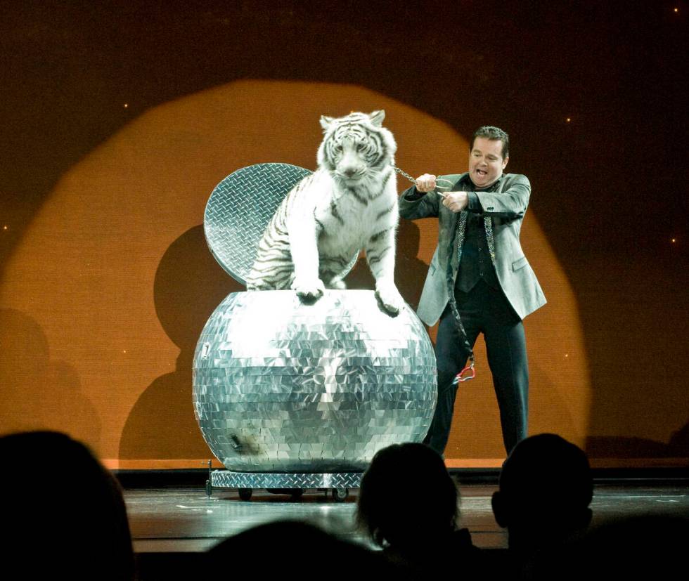 Magician Dirk Arthur performs his Fire Sphere illusion during his "Xtreme Magic" show at the Tr ...