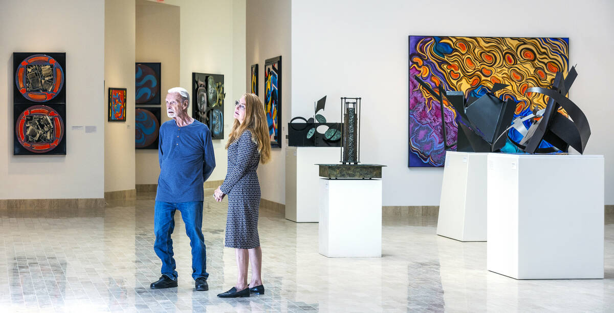 Dr. Robert Belliveau, left, with museum Executive Director Laura Sanders chat among Rita Deanin ...