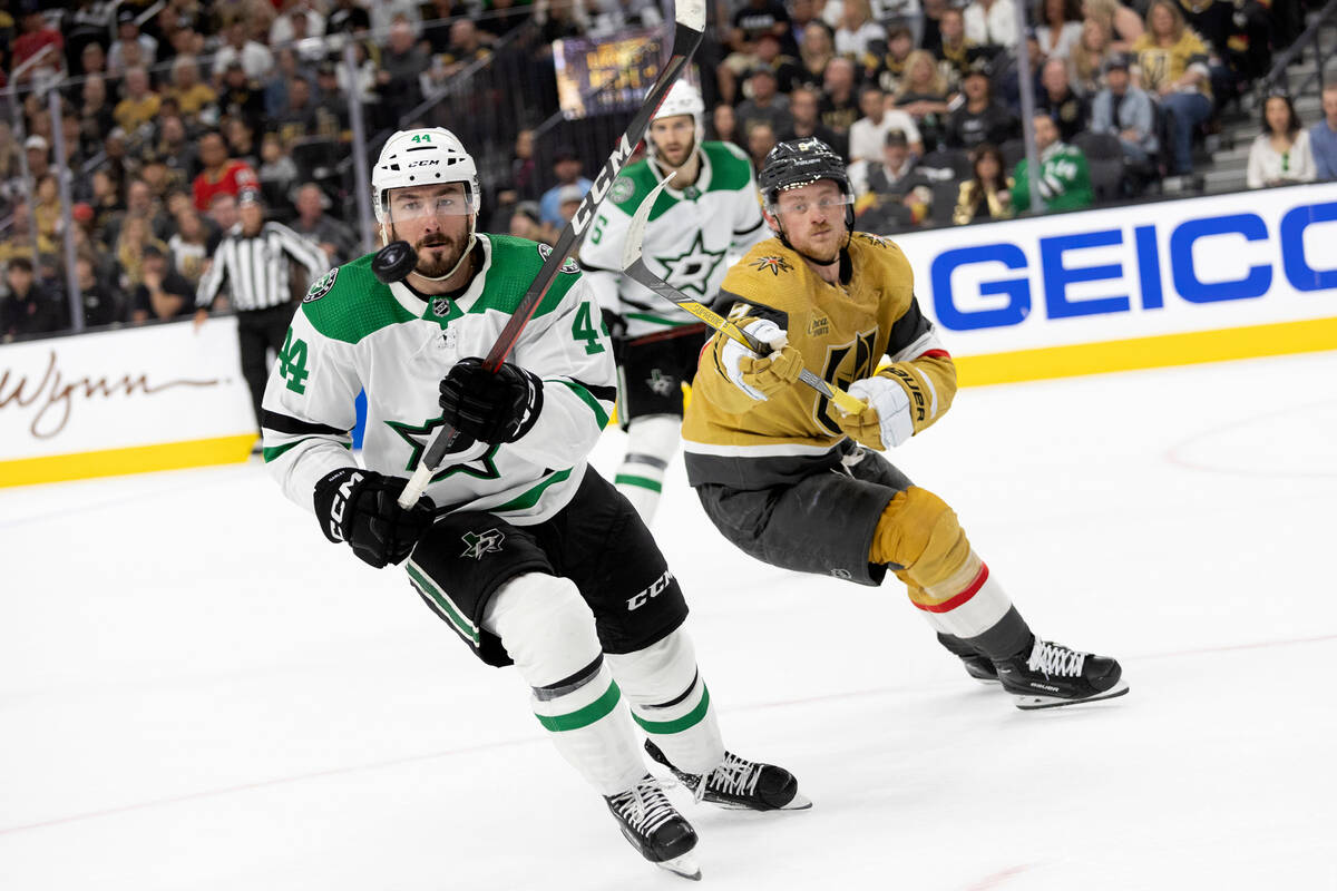 Dallas Stars defenseman Joel Hanley (44) and Golden Knights center Jack Eichel (9) skate for an ...