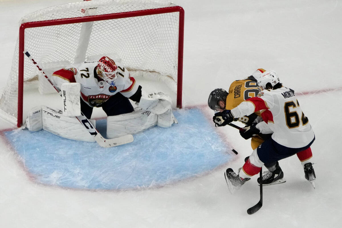 Vegas Golden Knights left wing William Carrier (28) scores on Florida Panthers goaltender Serge ...