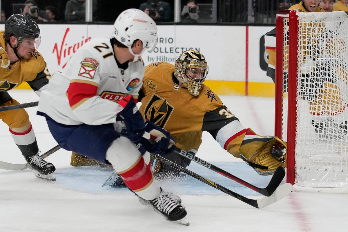 Vegas Golden Knights goaltender Adin Hill (33) blocks a shot by Florida Panthers center Nick Co ...