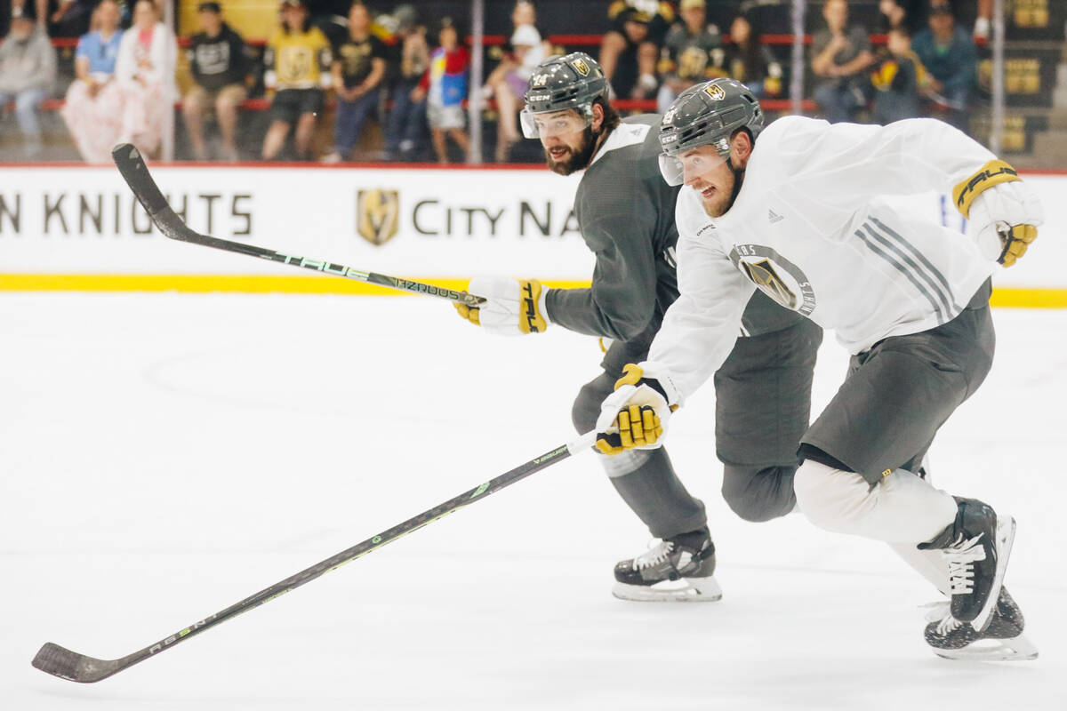 Golden Knights center Ivan Barbashev, front, chases after the puck along with defenseman Nicola ...