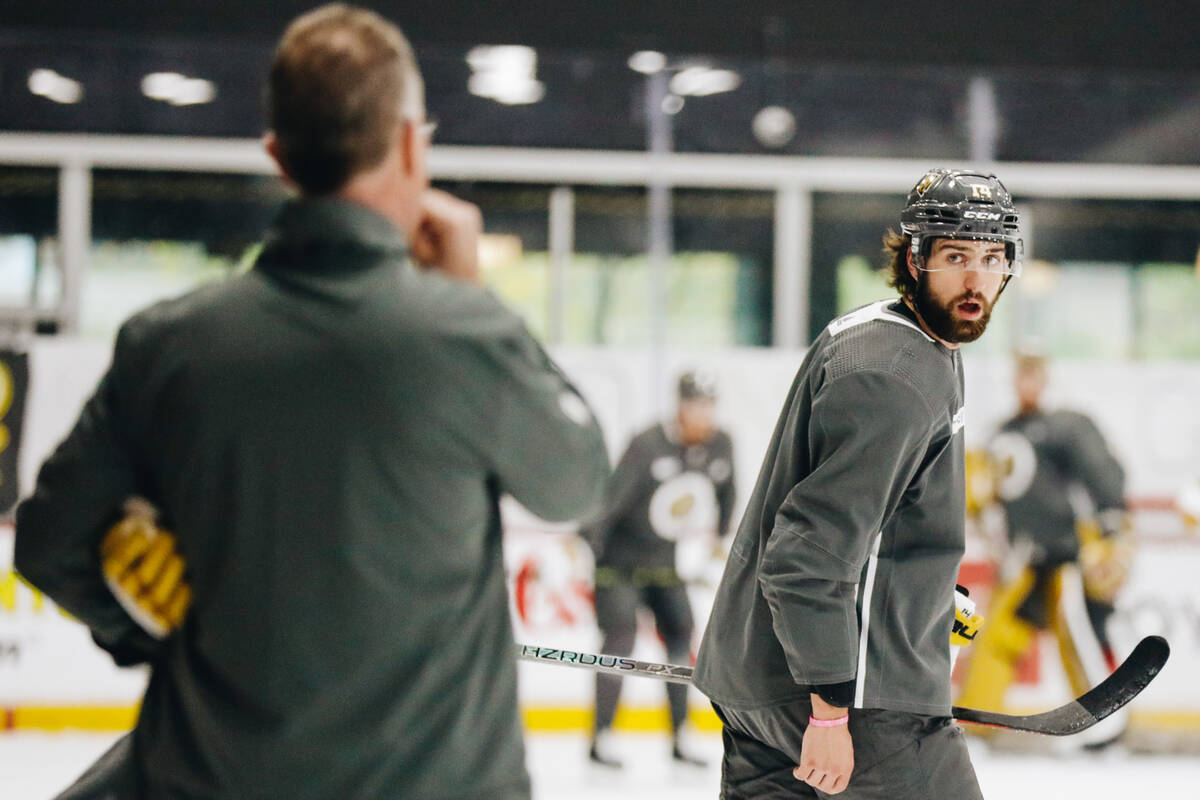 Golden Knights defenseman Nicolas Hague, right, listens to Knights assistant coach John Stevens ...