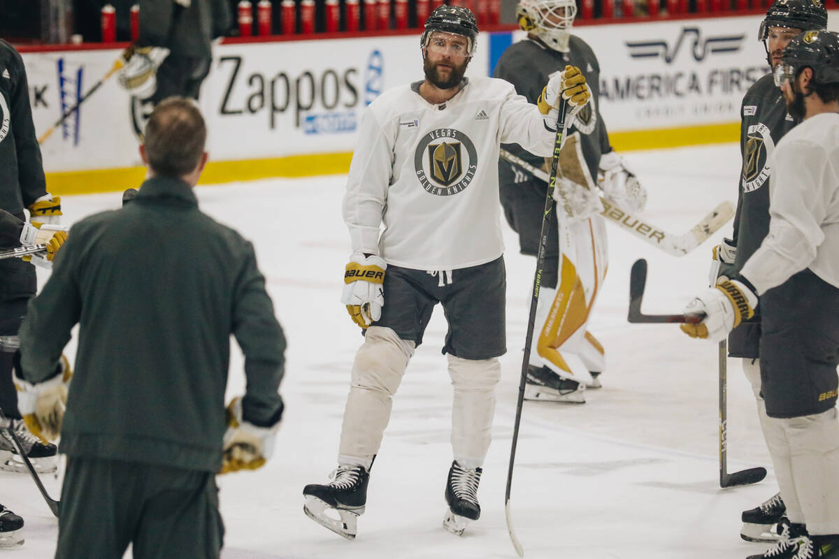 Golden Knights defenseman Alex Pietrangelo listens to assistant coach John Stevens during pract ...