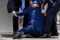 President Joe Biden falls on stage during the 2023 United States Air Force Academy Graduation C ...