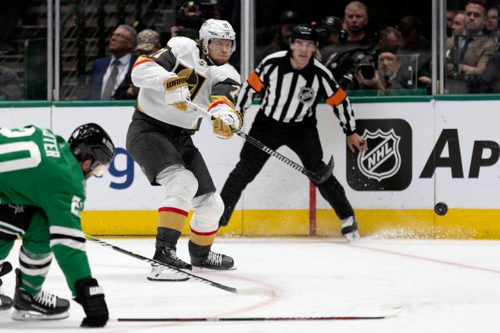 Golden Knights center William Karlsson (71) shoots against Dallas Stars defenseman Ryan Suter ( ...