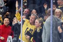 Hotel-casino owner Derek Stevens, center left, celebrates after the Golden Knights scored durin ...