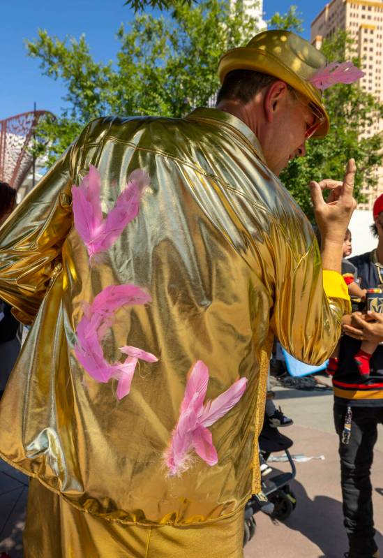 Golden Knights fan Russ Kuch of Las Vegas shows off his custom gold jacket outside before the s ...