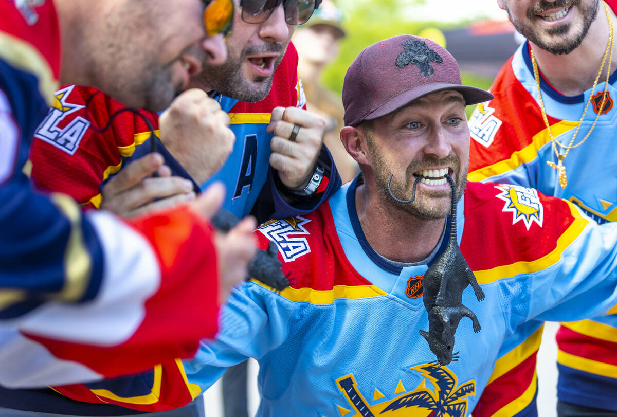 Florida Panthers fans complete with black rat get pumped outside before the start of Game 1 of ...