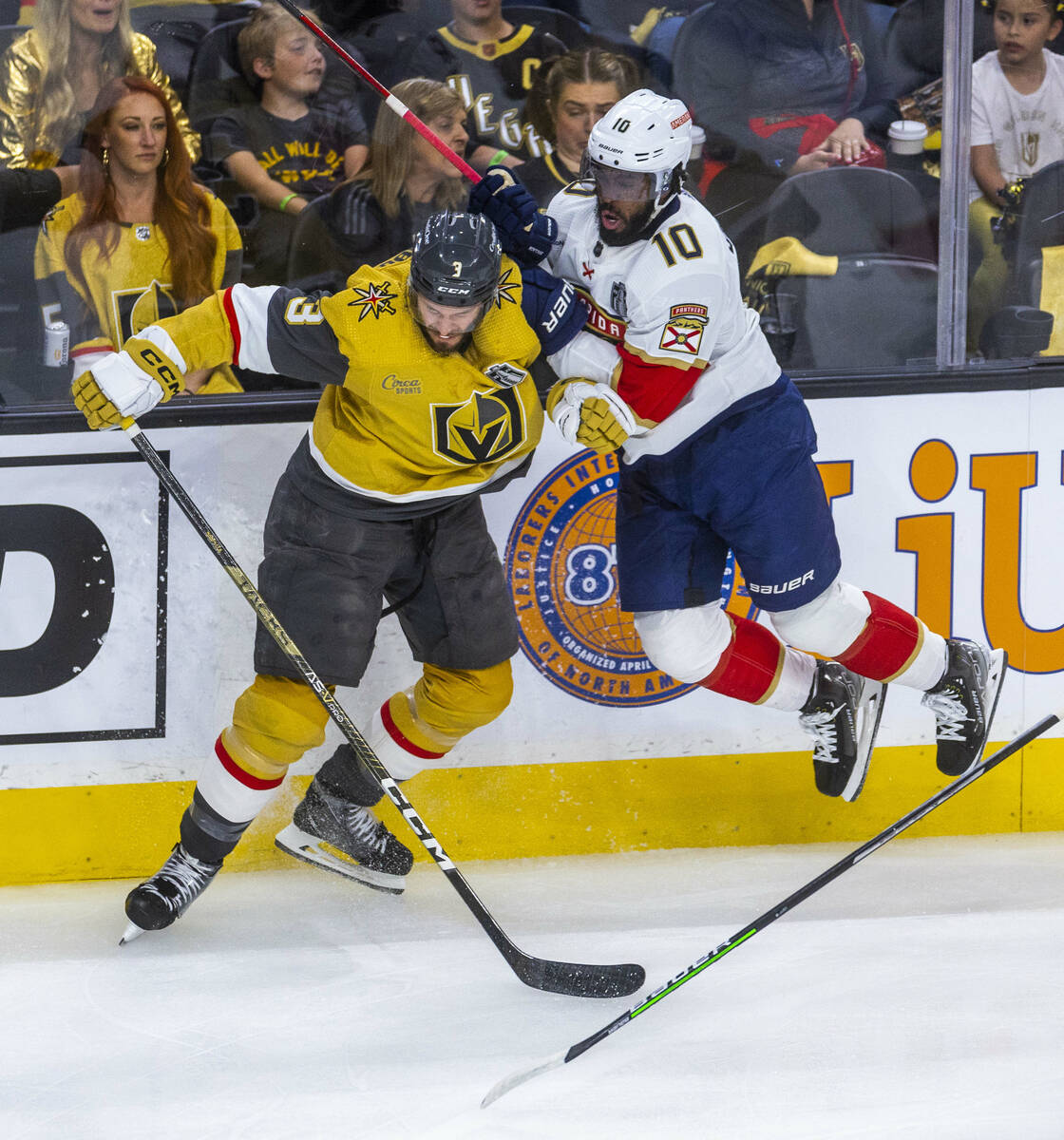 Golden Knights defenseman Brayden McNabb (3) and Florida Panthers left wing Anthony Duclair (10 ...