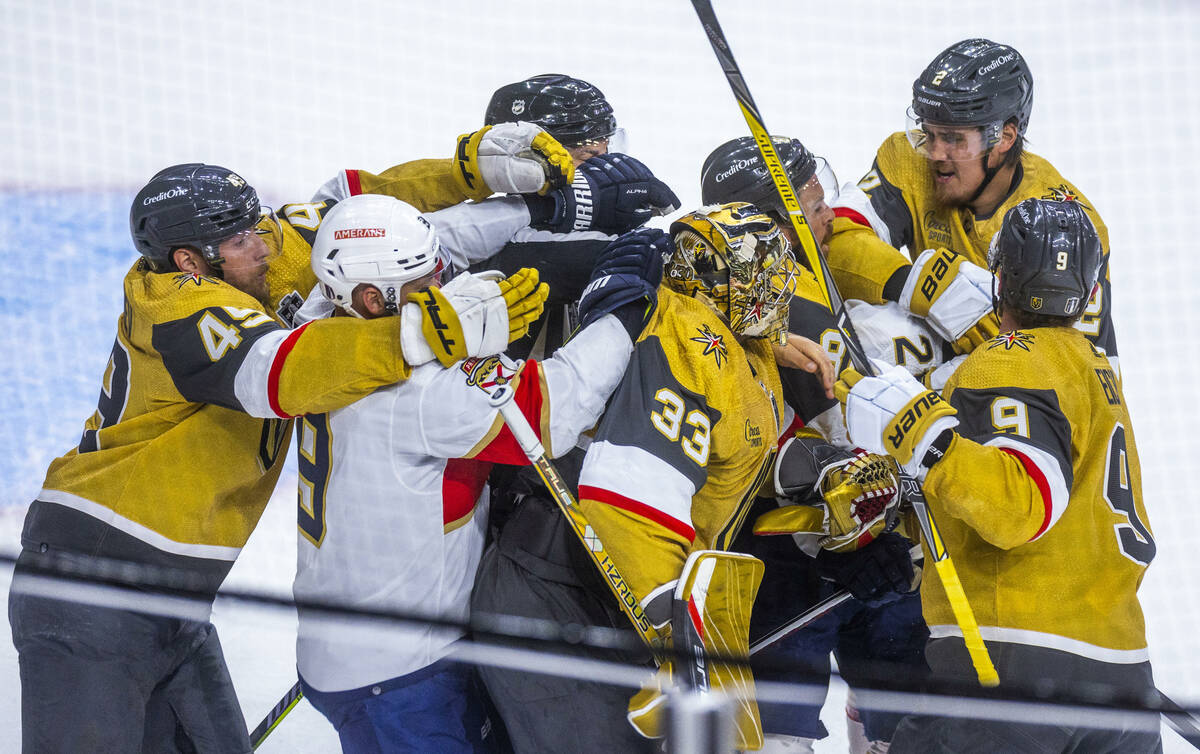 Golden Knights and Florida Panthers players fight during the first period in Game 1 of the NHL ...