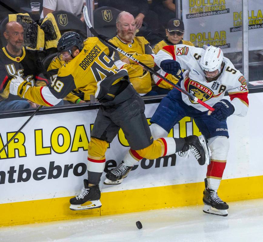 Golden Knights center Ivan Barbashev (49) and Florida Panthers defenseman Aaron Ekblad (5) coll ...