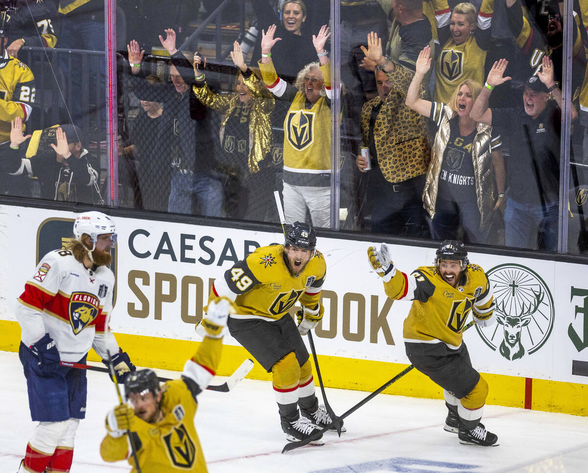 Golden Knights center Ivan Barbashev (49) and right wing Jonathan Marchessault (81) celebrate a ...