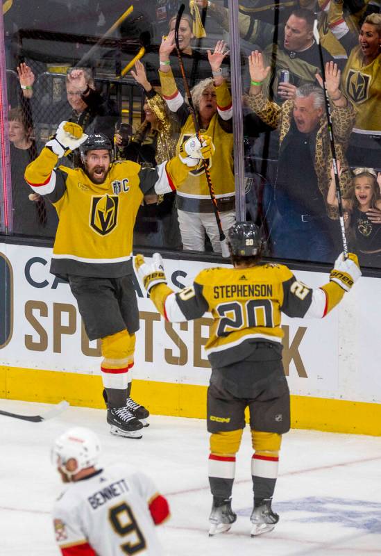 Golden Knights right wing Mark Stone (61) and center Chandler Stephenson (20) celebrate a goal ...