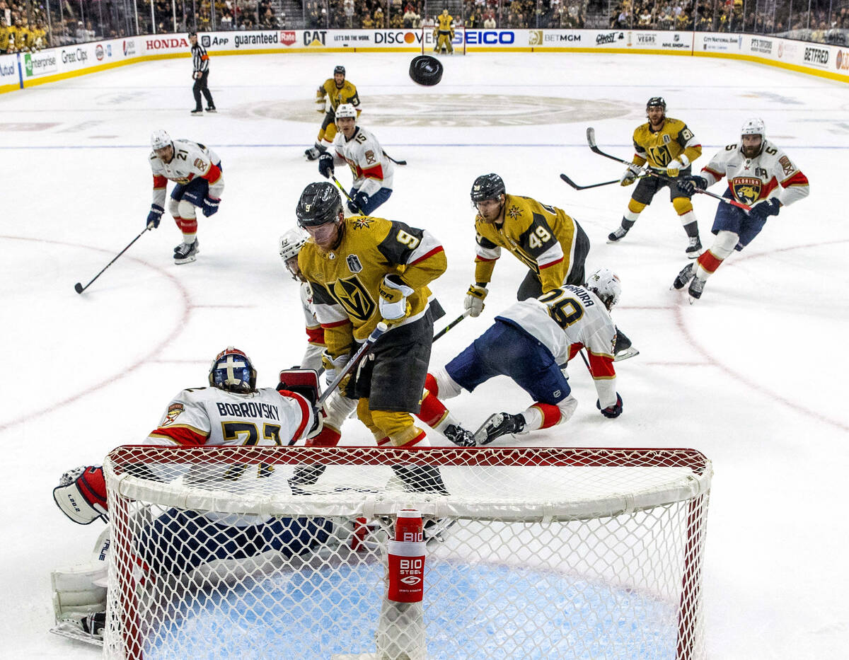 Golden Knights center Jack Eichel (9) has a shot deflected by Florida Panthers goaltender Serge ...