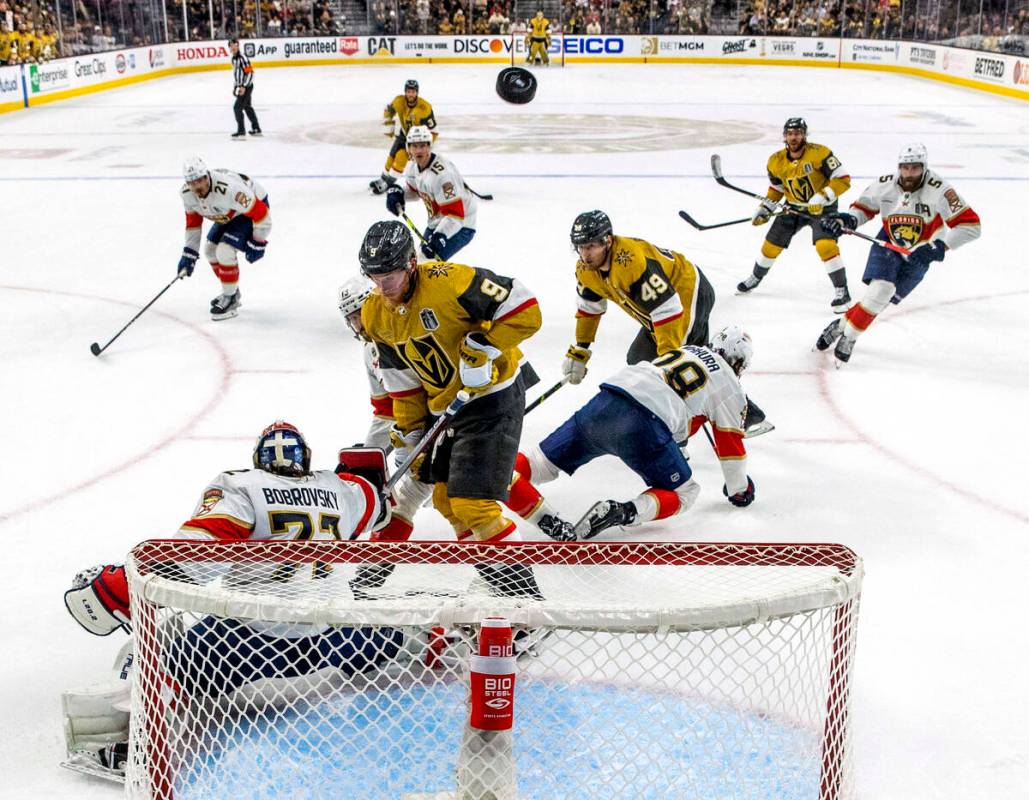 Golden Knights center Jack Eichel (9) has a shot deflected by Florida Panthers goaltender Serge ...