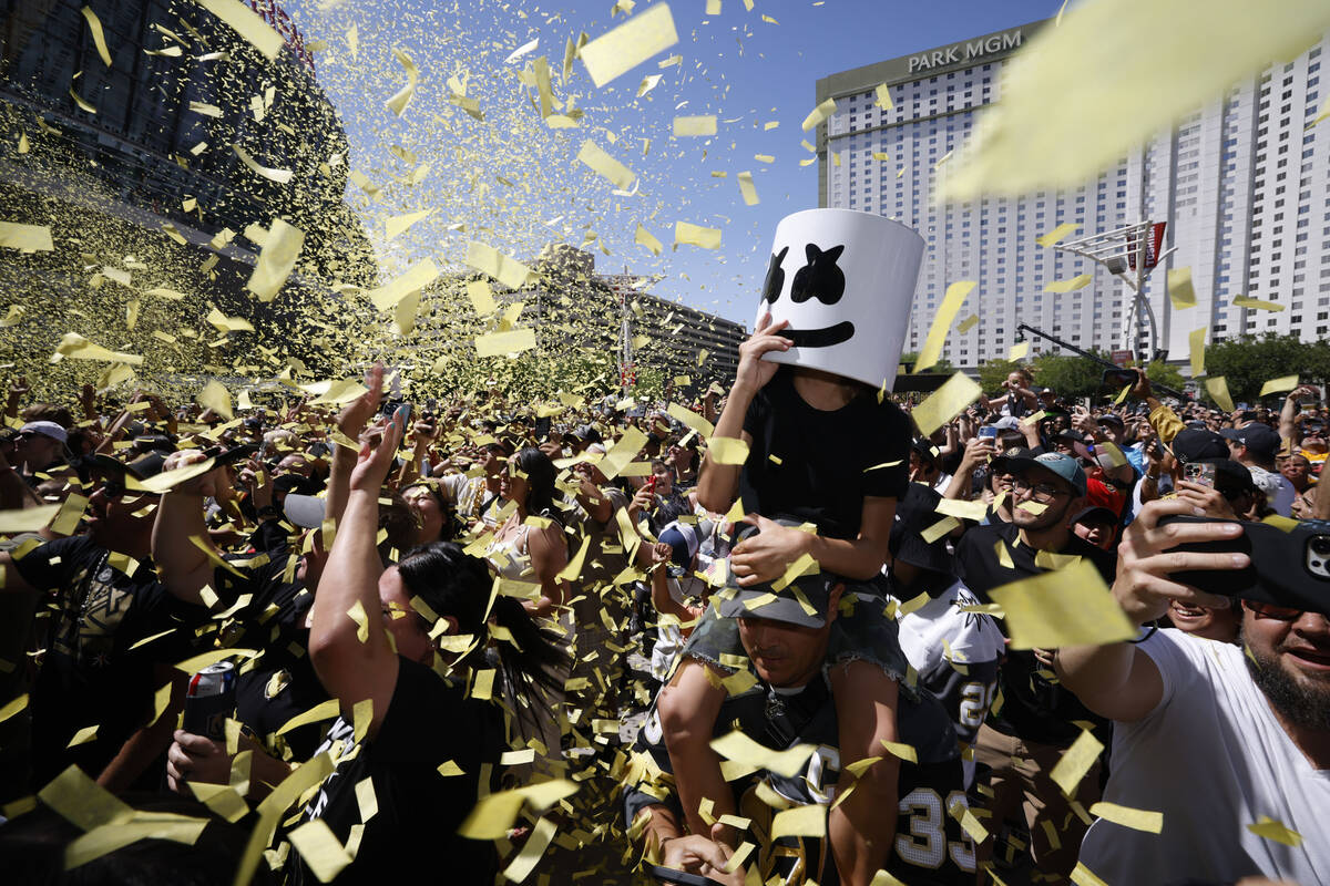 Jake Delgado, 10 of Las Vegas wears a Mashmello mask as riding on his father David’s sho ...