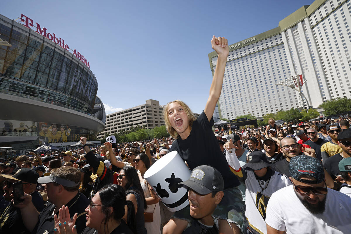 Jake Delgado, 10 of Las Vegas holds a Mashmello mask as riding on his father David’s sho ...