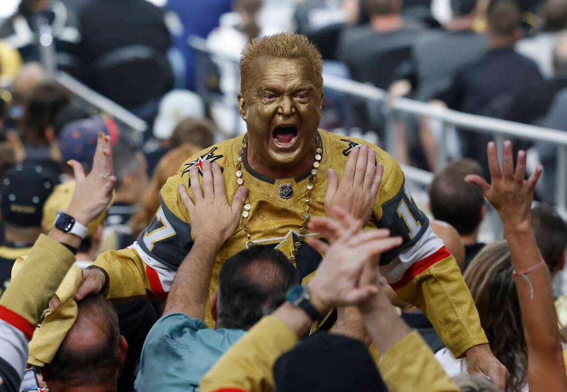 A Golden Knights fan cheers during the second period in Game 1 of the NHL hockey Stanley Cup Fi ...