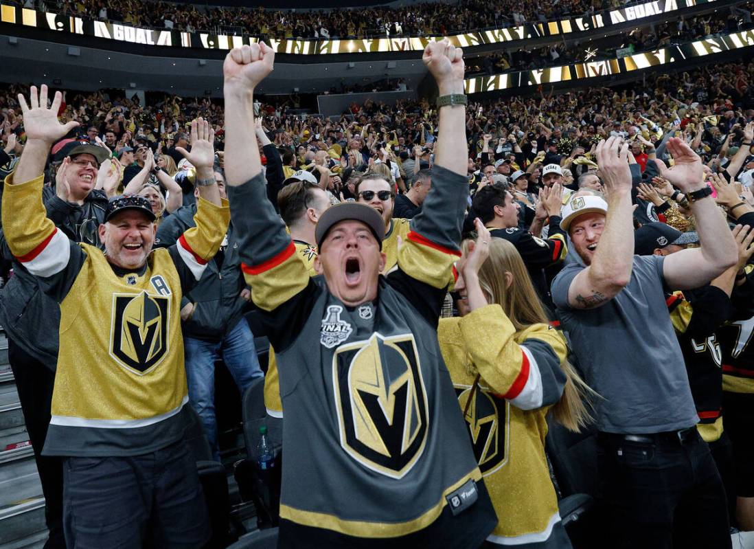 Golden Knights fans react after Golden Knights defenseman Zach Whitecloud (2) scored a goal aga ...