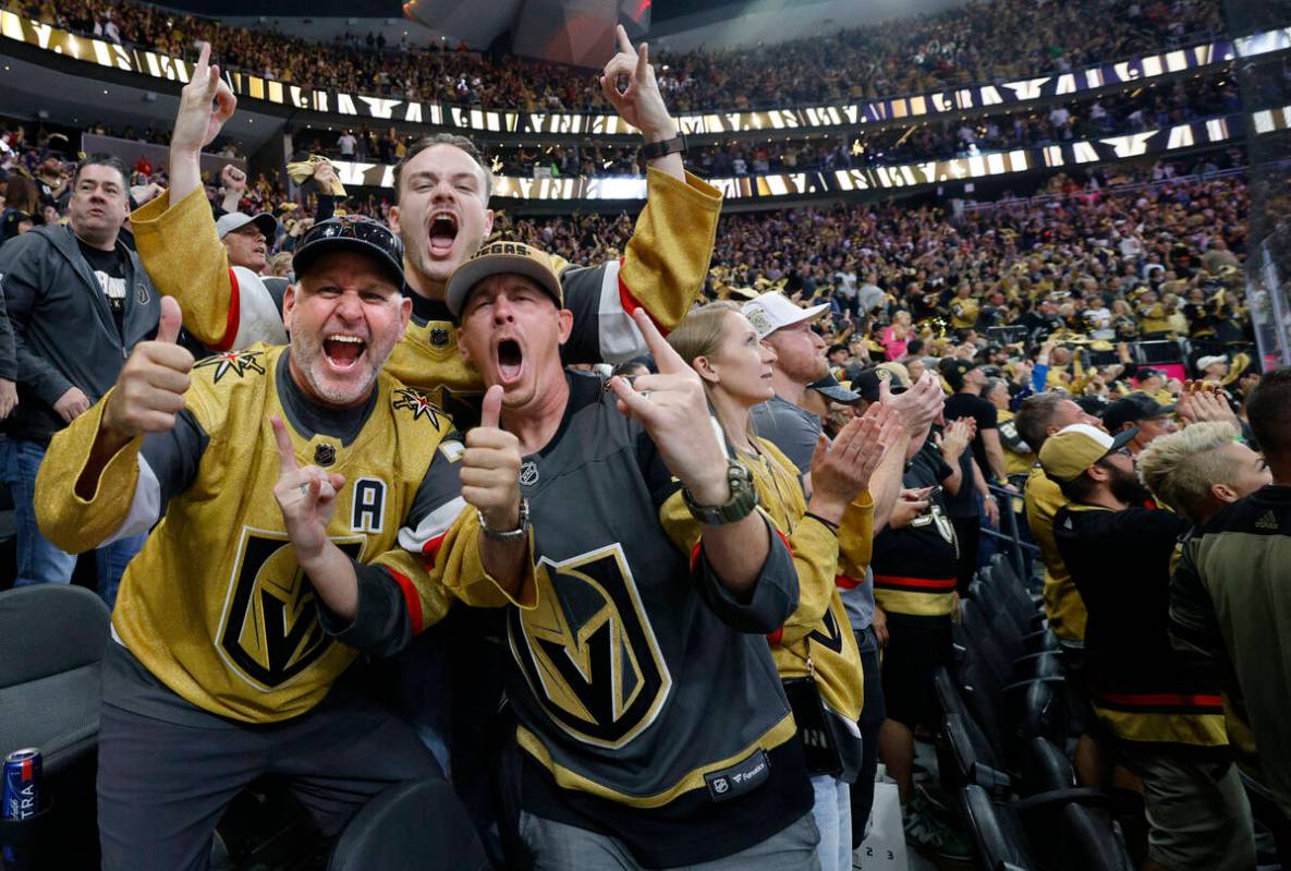 Golden Knights fans react after Golden Knights defenseman Zach Whitecloud (2) scored a goal aga ...