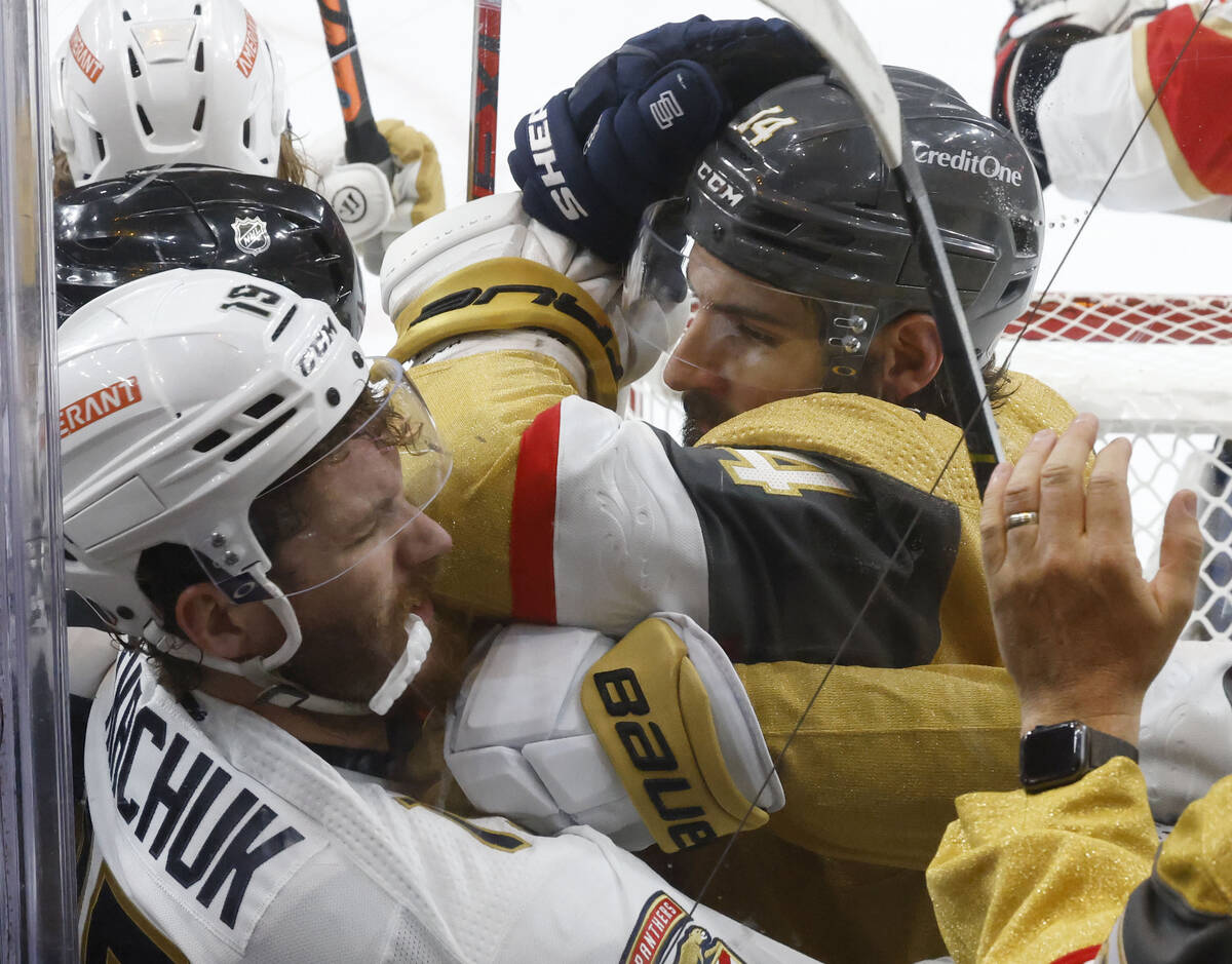 Florida Panthers left wing Matthew Tkachuk (19) fights with Golden Knights defenseman Nicolas H ...