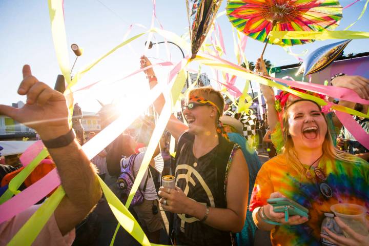 Attendees celebrate during a Pride Parade during day 2 of the Life is Beautiful festival in dow ...