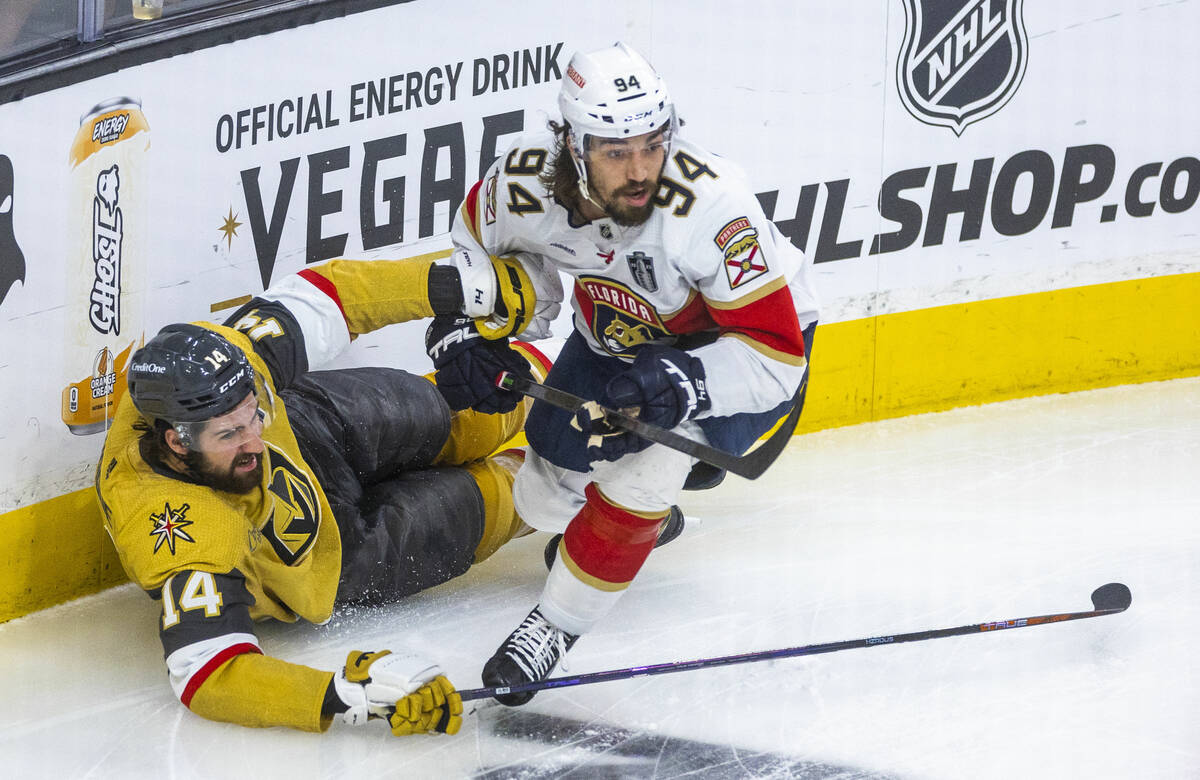 Golden Knights defenseman Nicolas Hague (14) mistaken down by Florida Panthers left wing Ryan L ...